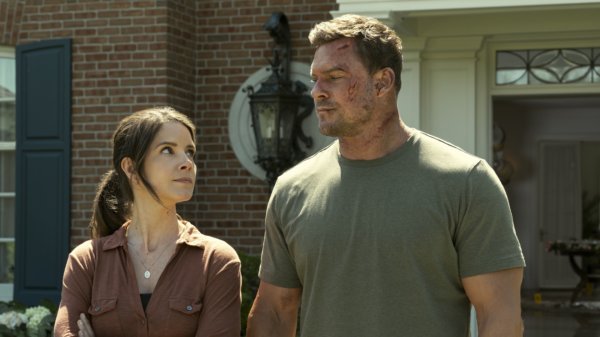 Reacher looking at another character from the TV show.