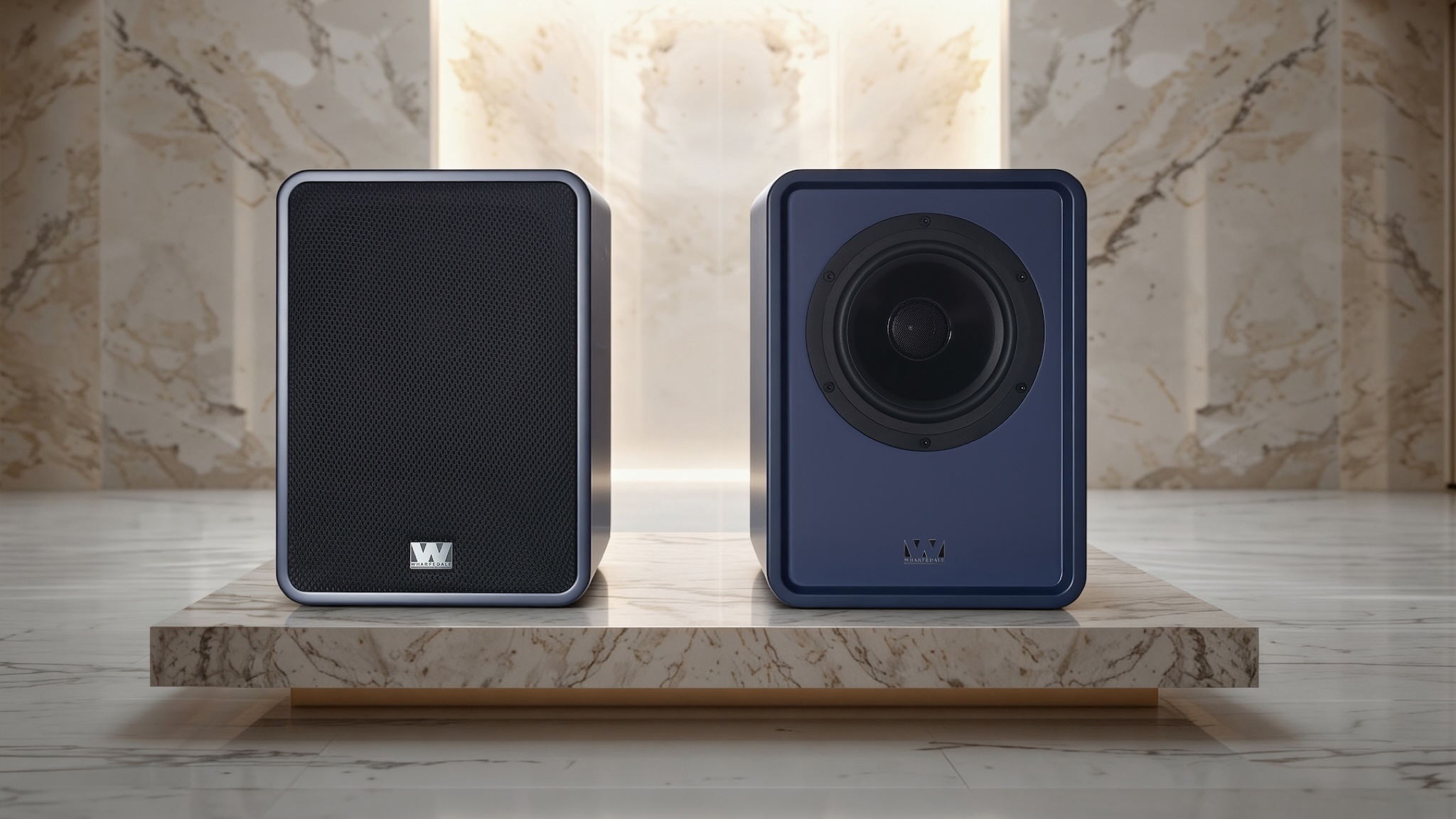 Wharfedale Denton 1S speakers in blue on a sort of marble pedestal