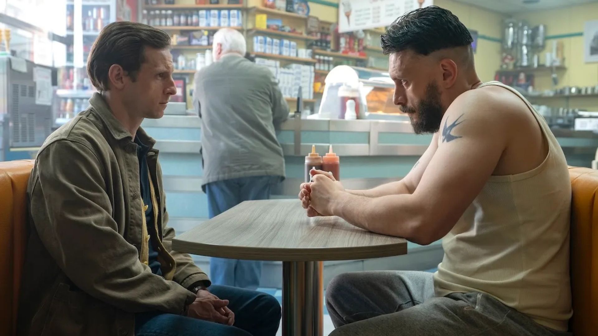 Jamie Bell and Richard Gadd talk at a dining table