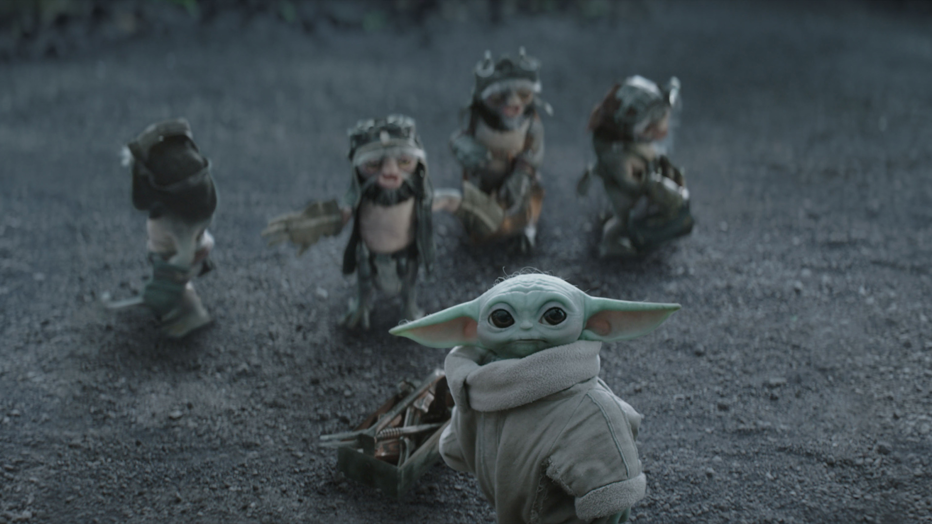 Baby Yoda and the Ancellans looking at something in The Mandalorian and Grogu