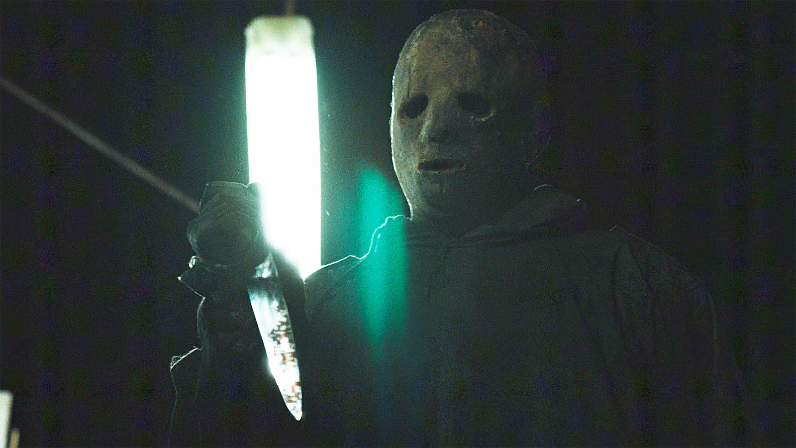 A close-up of The Boogeyman holding a knife at night in episode 8 of Widow's Bay.