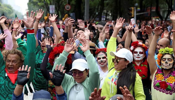 People take part in an attempt to break the Guinness World Record for the world's largest Mexican wave along Avenida Reforma as part of activities leading up to the 2026 FIFA World Cup, in Mexico City, Mexico, June 6, 2026. – Reuters