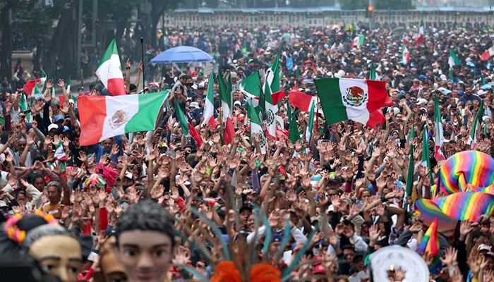 People take part in an attempt to break the Guinness World Record for the world's largest Mexican wave along Avenida Reforma as part of activities leading up to the 2026 FIFA World Cup, in Mexico City, Mexico, June 6, 2026. – Reuters