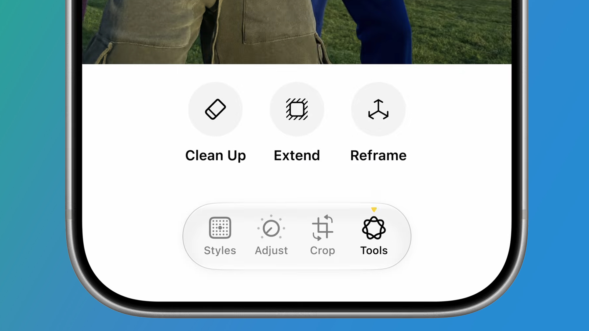An iPhone on a blue background showing the Apple Photos app in iOS 27
