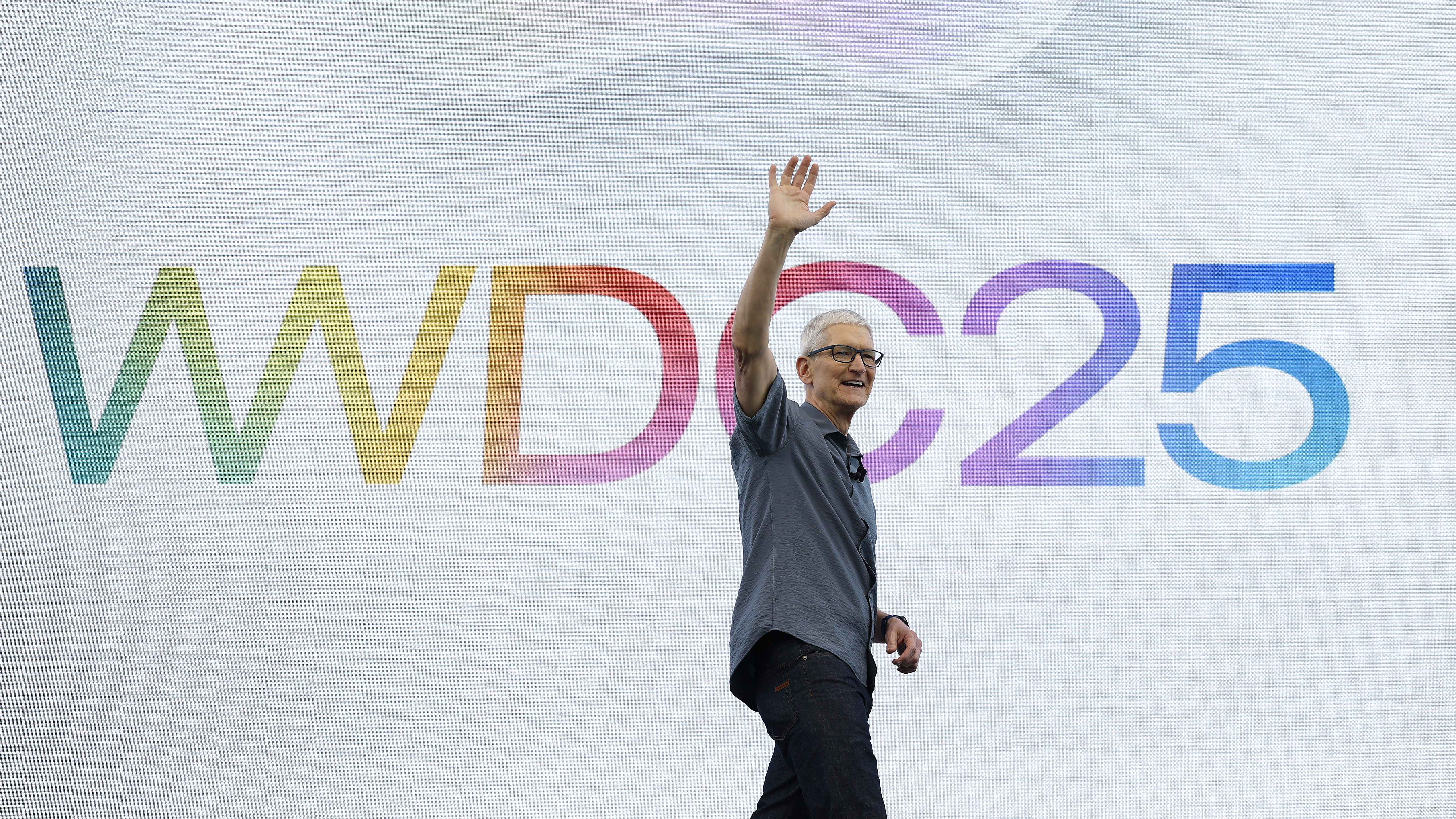 Tim Cook waving on stage at WWDC 2025
