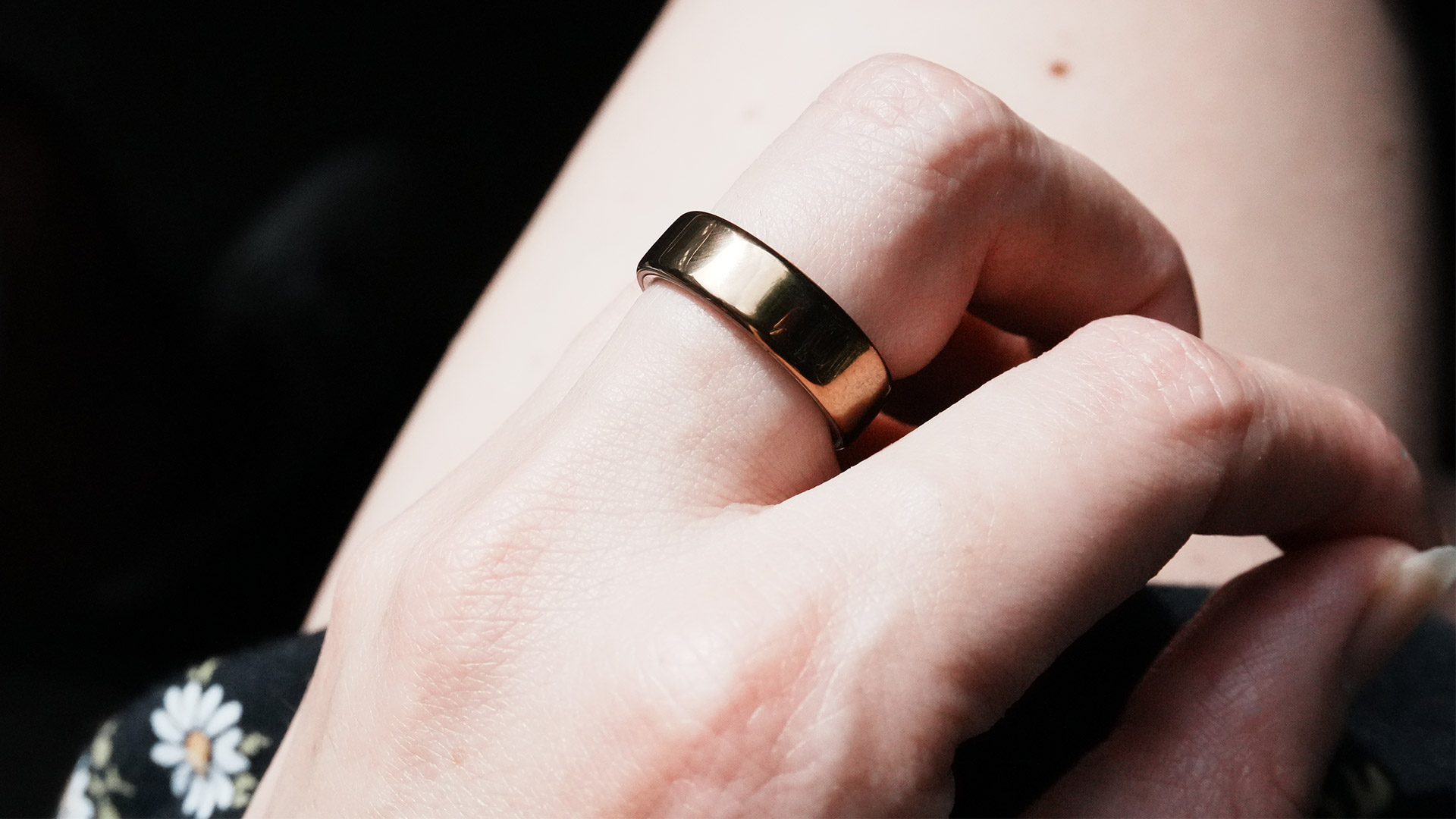 A close-up of a hand wearing the Oura Ring 5