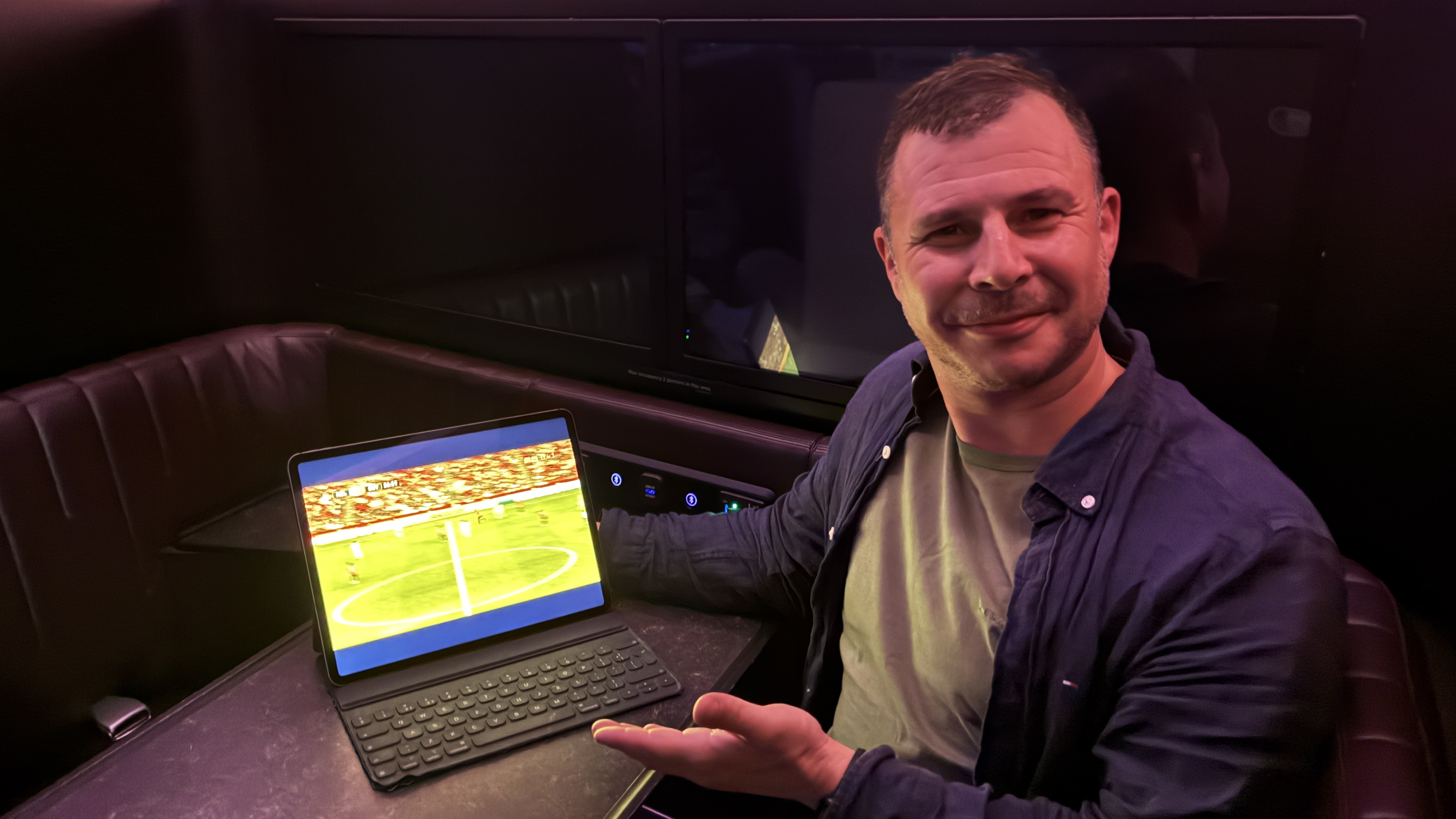 A person watching the World Cup on a Virgin Atlantic flight via Starlink