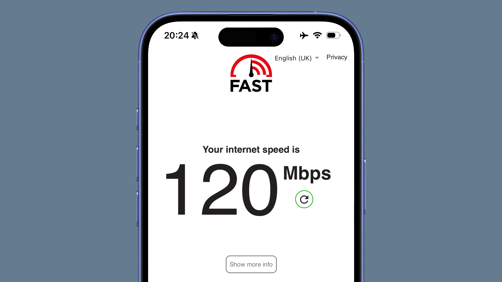 A phone on a gray background showing an internet speed check