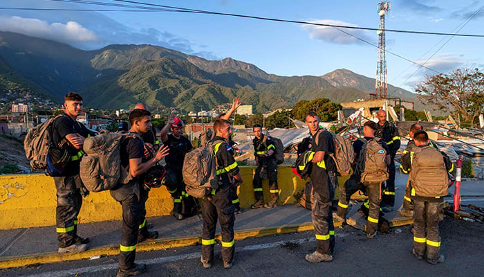 Members of the French Civil Security Training and Intervention Regiment (UIISC 7) attend an area affected by the collapse of a building in the state of La Guaira, Venezuela, on June 28, 2026, following the earthquakes. — AFP