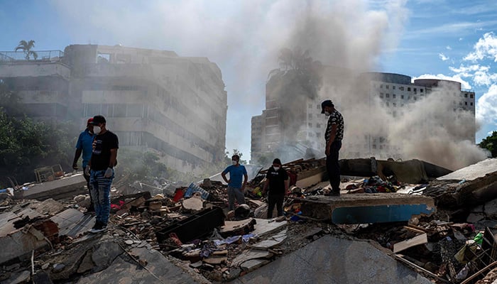 Rescuers and volunteers search for survivors in La Guaira, La Guaira state, Venezuela, on June 28, 2026, after two earthquakes. — AFP