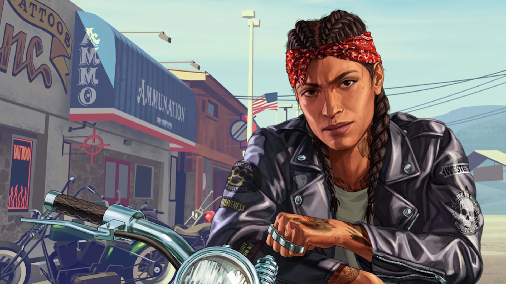 A motorcyclist sits and looks at the camera.