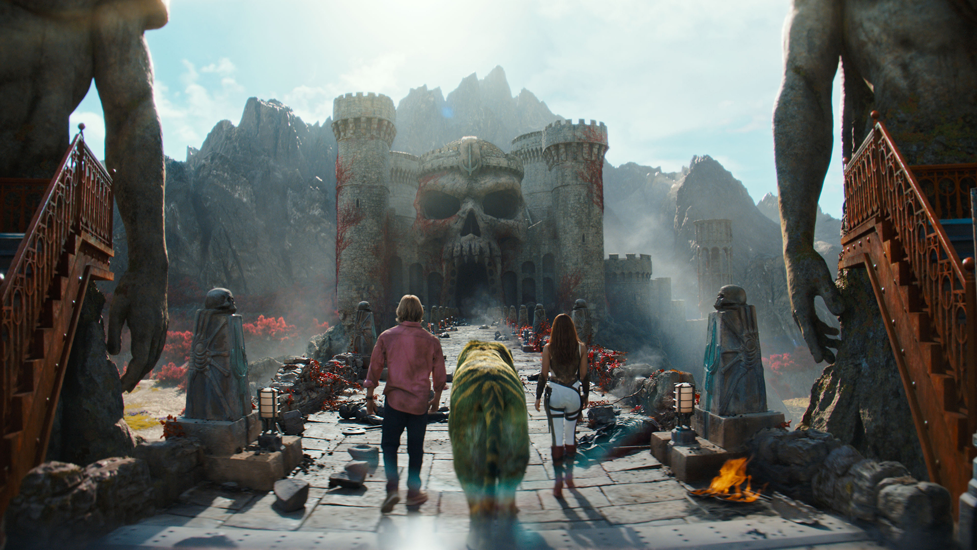 Adam, Cringer and Teela walking towards Castle Grayskull in Amazon's Masters of the Universe movie