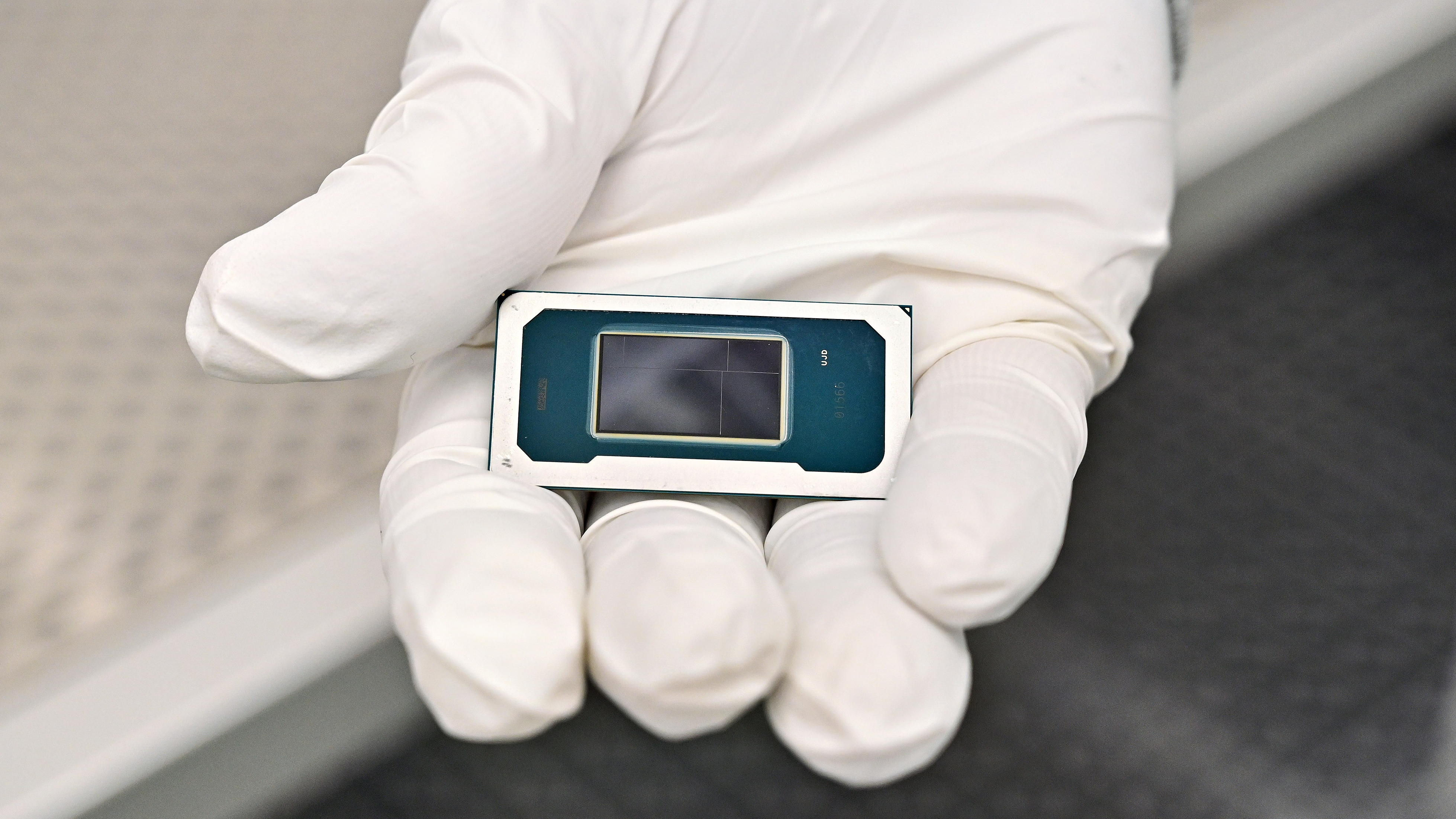 A hand holding an Intel Panther Lake mobile processor