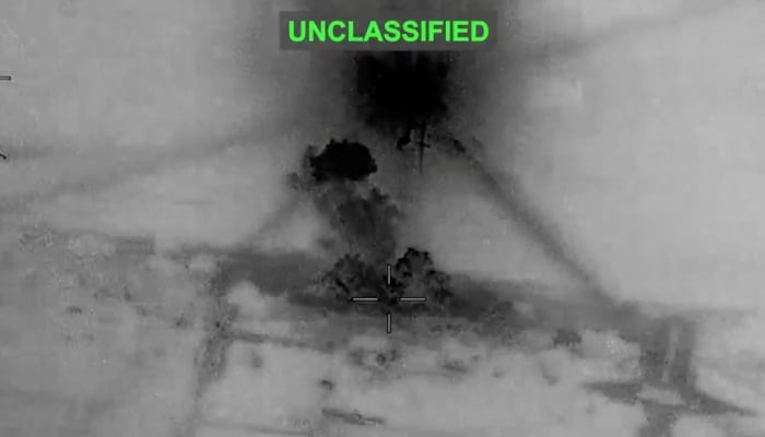 Smoke rises from explosions at an unknown location, following what U.S. Central Command says were strikes against Iran in response to an Iranian drone attack on a cargo ship in the Strait of Hormuz, in this screenshot from a video released June 26, 2026. – Reuters