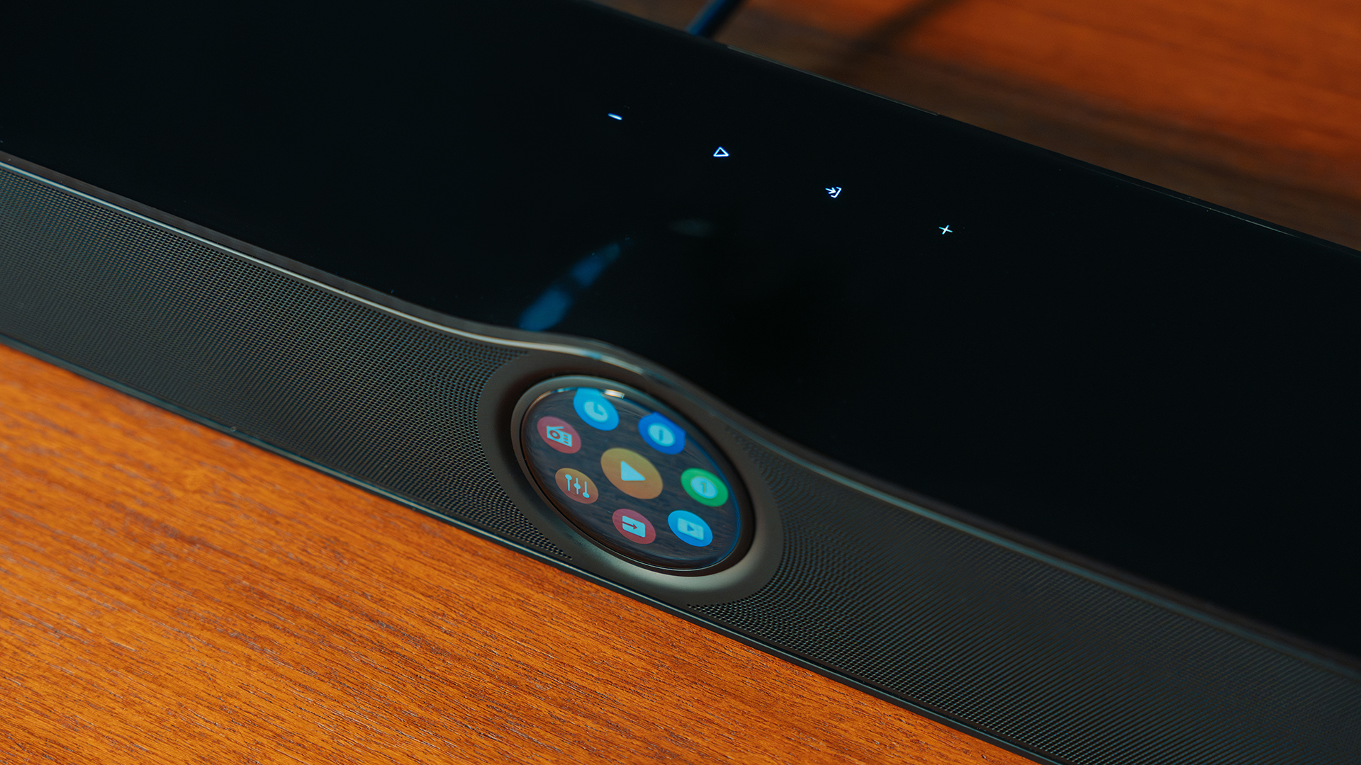 The WiiM Bar screen in close-up, which also displays touch controls on its top surface