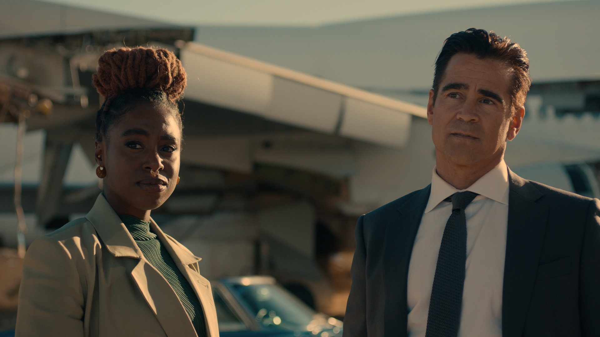 Kirby Howell-Baptiste and Colin Farrell's characters are side by side in Apple TV Plus' sugar show