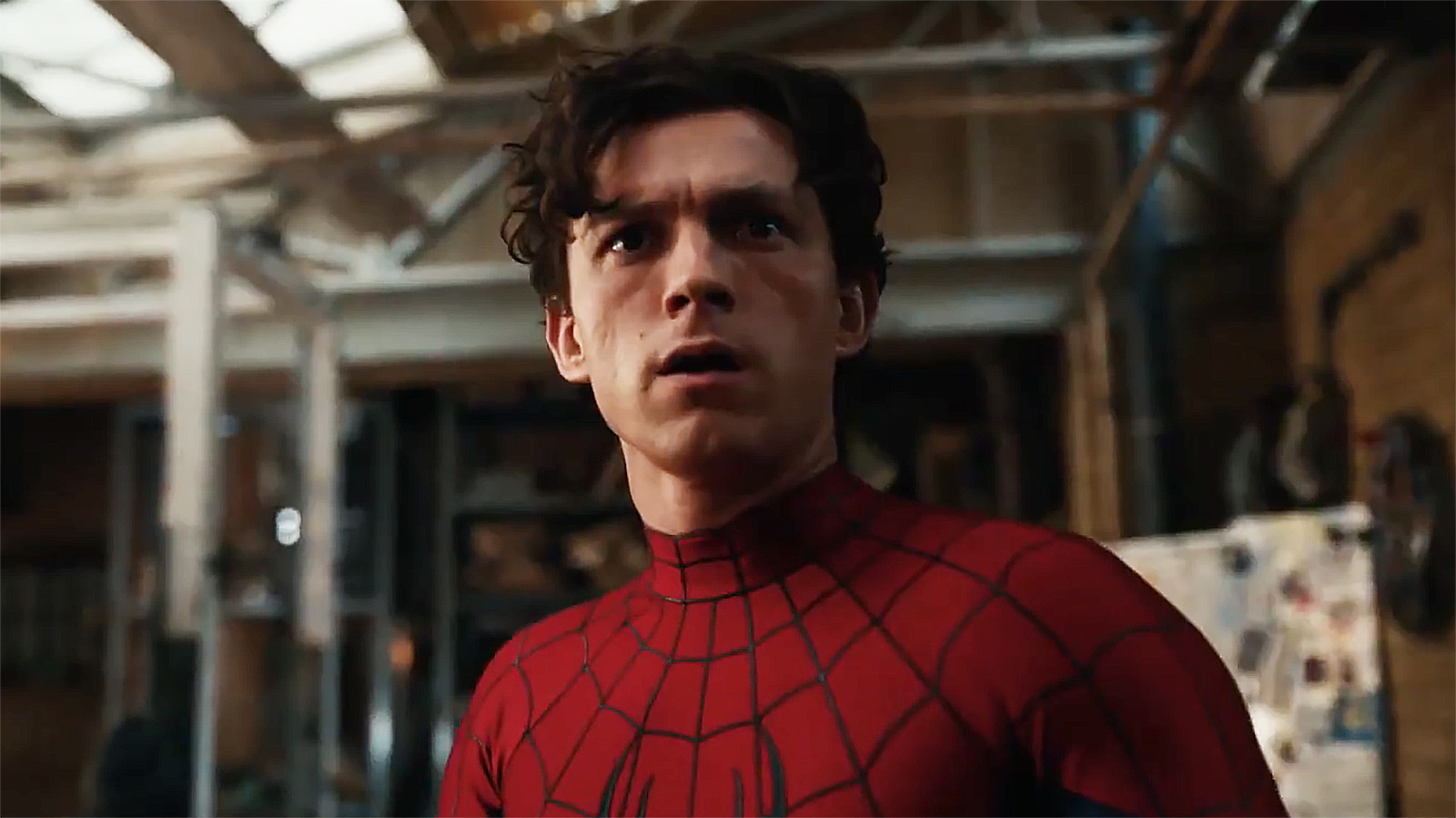 Tom Holland's Peter Parker looks confused while wearing his superhero suit in Spider-Man: Brand New Day