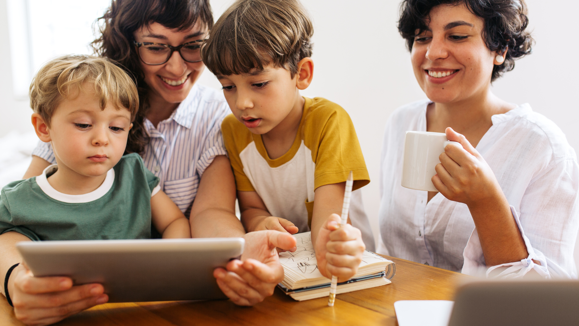 Family watching YouTube content on a tablet