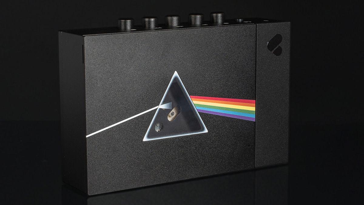 The Pink Floyd x We Are Rewind cassette player featuring the Dark Side of the Moon album logo on the front, with a triangular window where the prism would be.