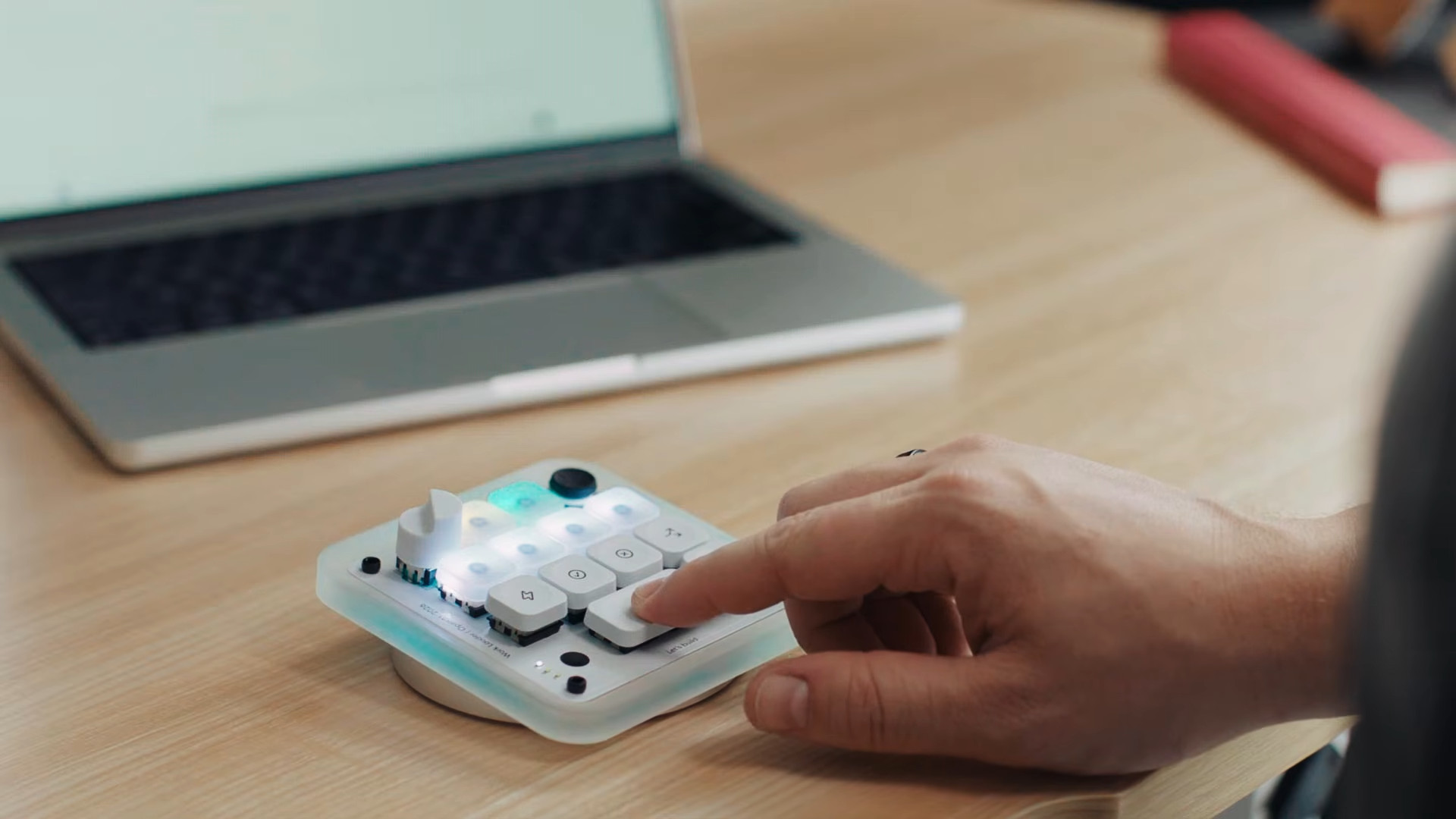Codex Micro used with a person pressing the microphone button