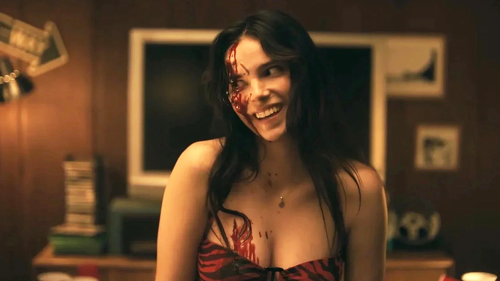 A bloodied Nikki with a haunting smile on her face in Obsession.