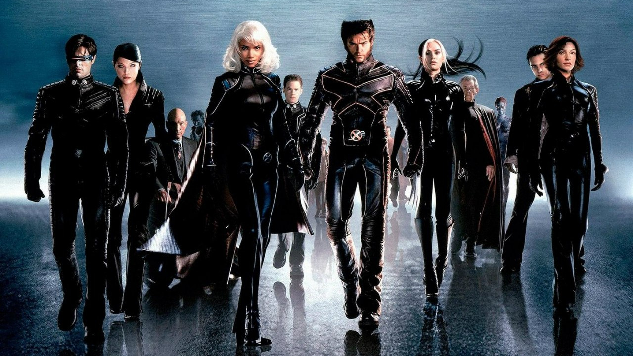 A press image showing the X-Men walking towards the screen in their 2000 film.