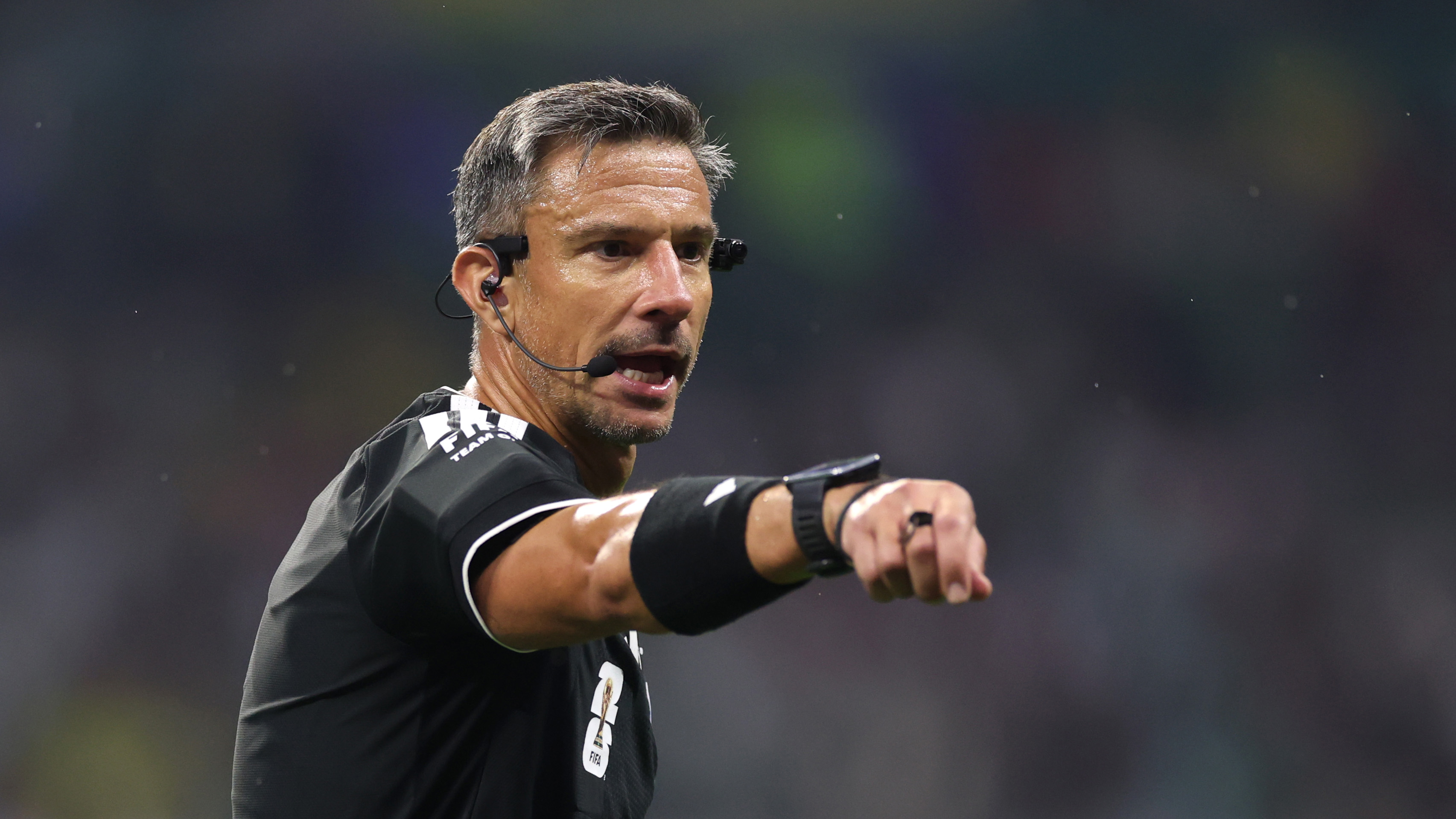 A referee with headphones at the 2026 FIFA World Cup