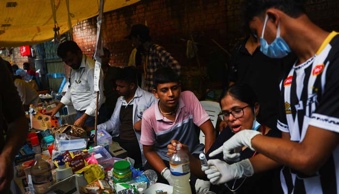 A makeshift medical camp has been formed to provide treatment to supporters of India's Cockroach Janata Party (CJP) during ongoing protests, two days after thousands of protesters marched towards parliament demanding the resignation of Education Minister Dharmendra Pradhan over exam leaks, at Jantar Mantar in New Delhi, India, on July 22, 2026. – Reuters