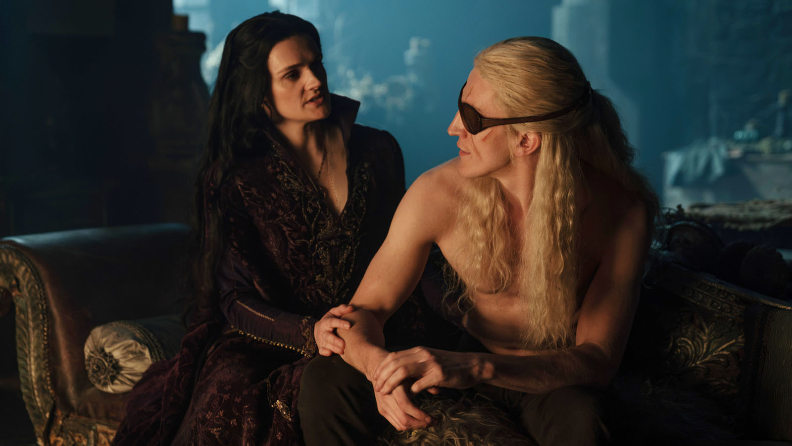 Alys and Aemond look at each other in a dark, candlelit room in House of the Dragon season 3, episode 6