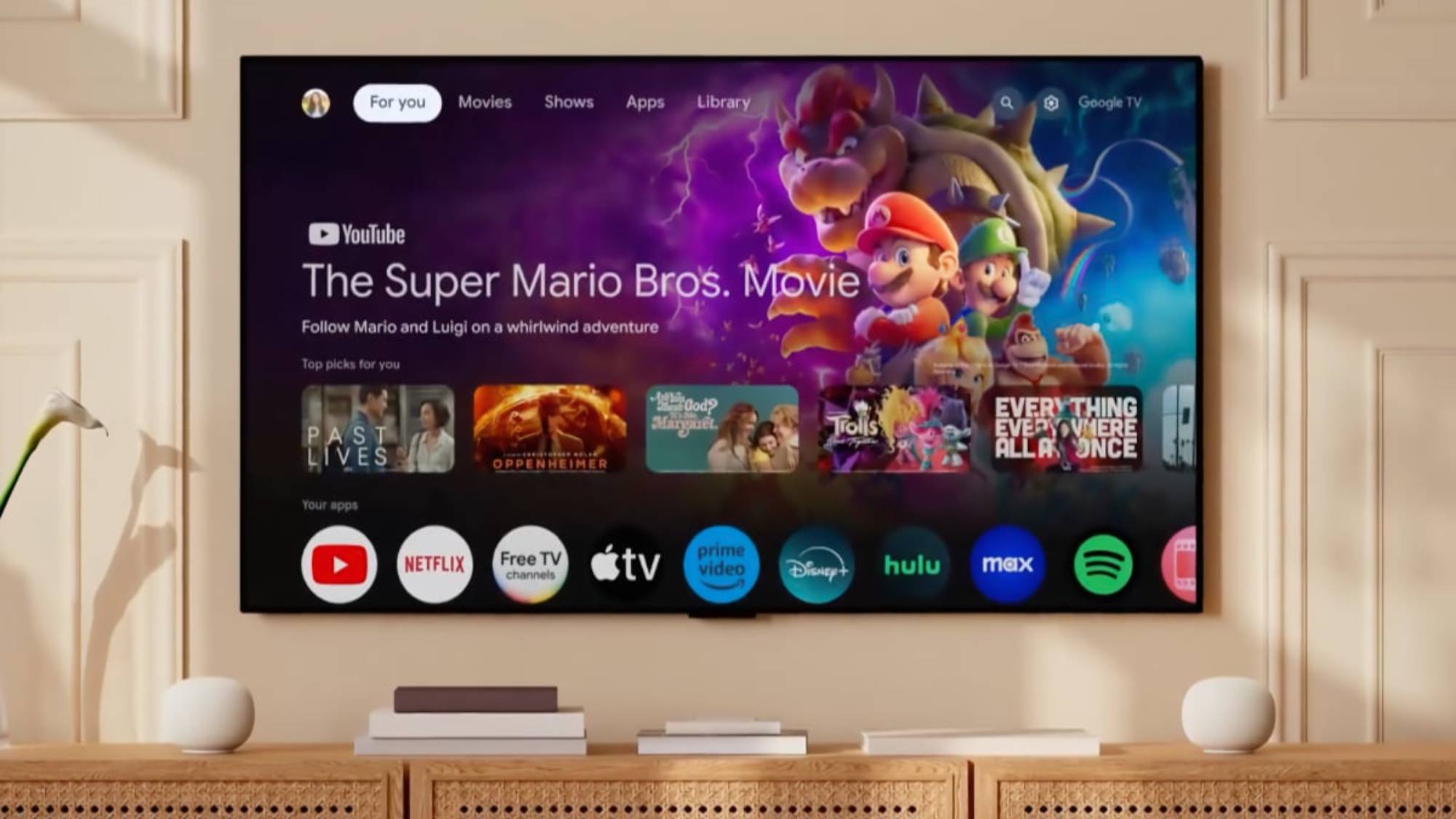 The Google TV Streamer interface with two Google Home Speakers connected to each side