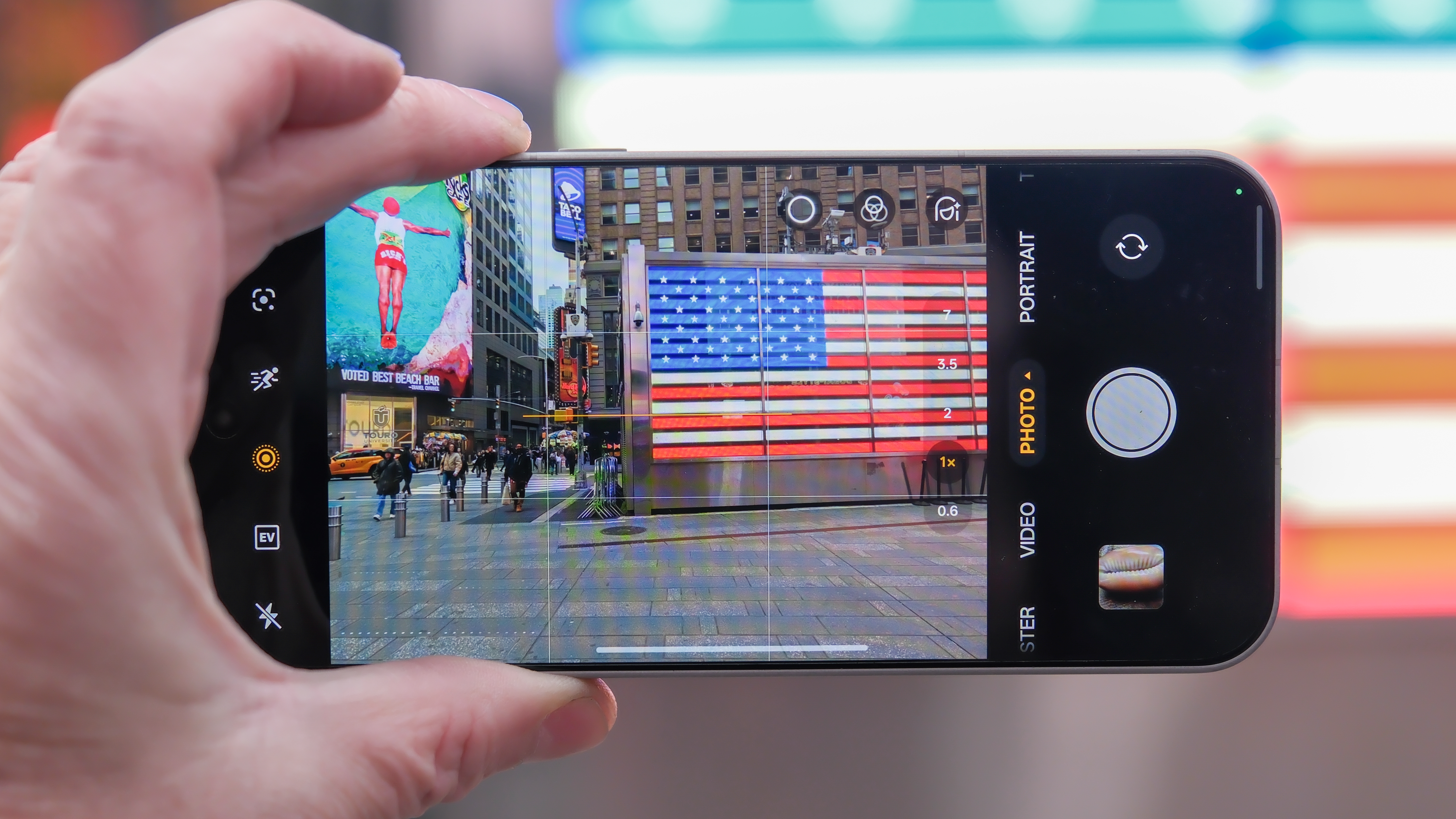 OnePlus 15 in Times Square, New York, on the busy street showing the cameras and sides of the phone, plus the home screen panels and settings menus