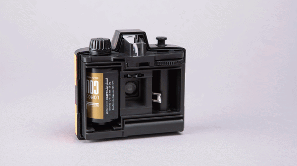 Animation of Lomography half frame simple use rechargeable film camera with back open and different film rolls loaded