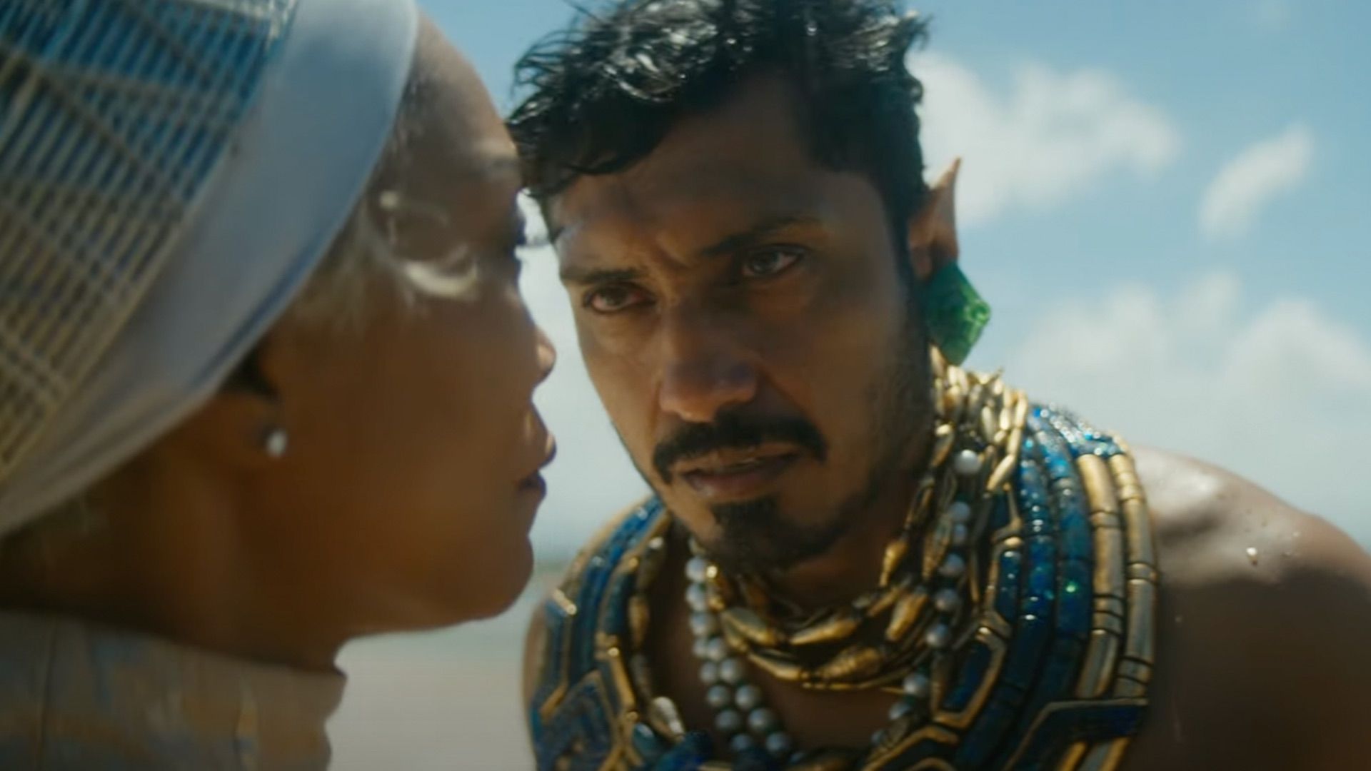 Namor stares intently at Queen Ramonda on an undisclosed beach in Black Panther: Wakanda Forever