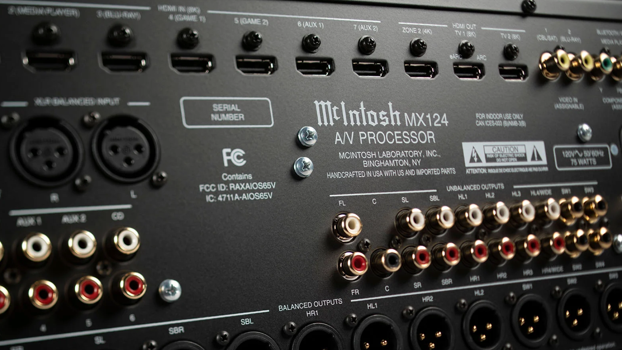 Promotional photo of the McIntosh MX124 A/V processor showing some of the many connections on the back