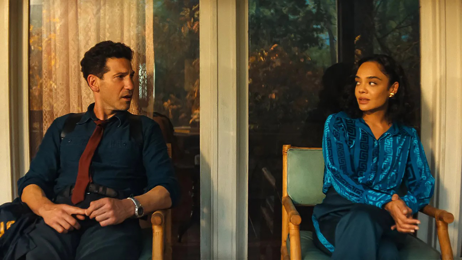 Jack and Anna look at each other while sitting at Su & Yours on Netflix