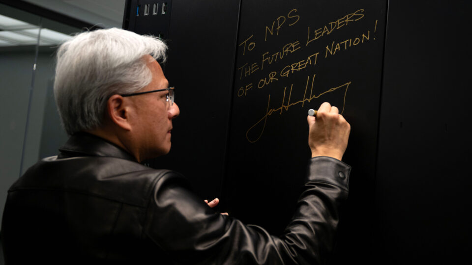 Nvidia CEO Jensen Huang signs the NVIDIA DGX GB300 artificial intelligence supercomputer donated to the Naval Postgraduate School in Monterey, California.