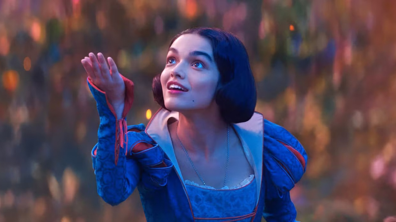 Rachel Zegler's Snow White raises her right hand in her live-action film adaptation of the same name